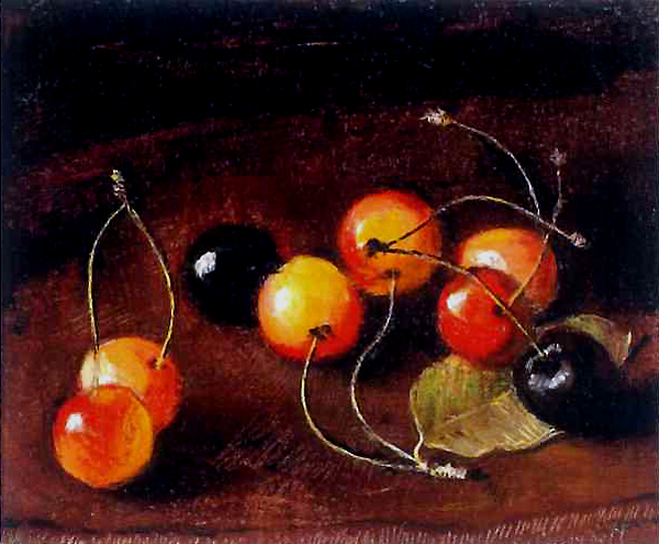 Handful of mixted cherries with a leaf