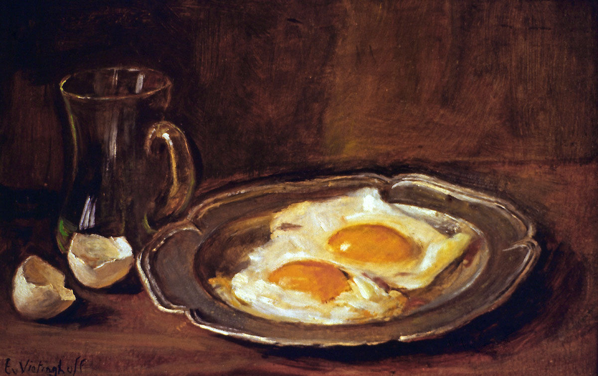 Fried eggs on pewter plate and beer-glass