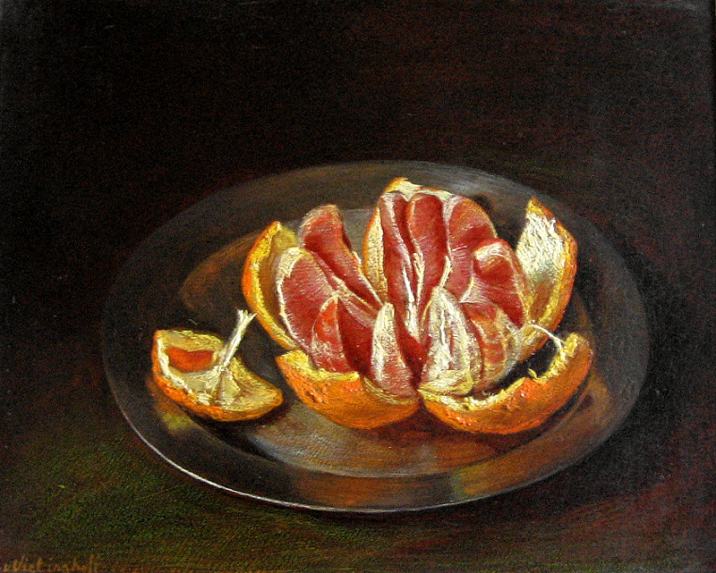 Aufgebrochene Orange auf Zinnteller