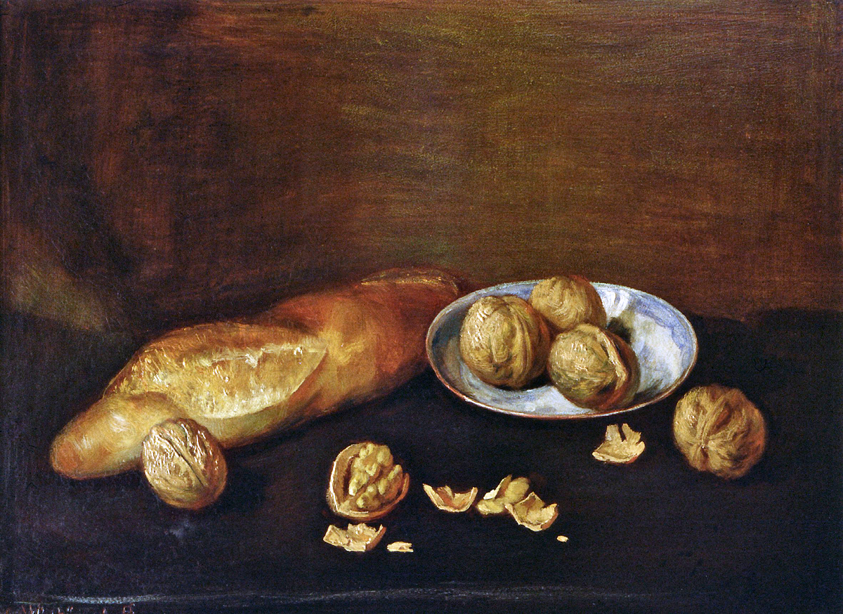 Baguette und Walnüsse auf Tellerchen