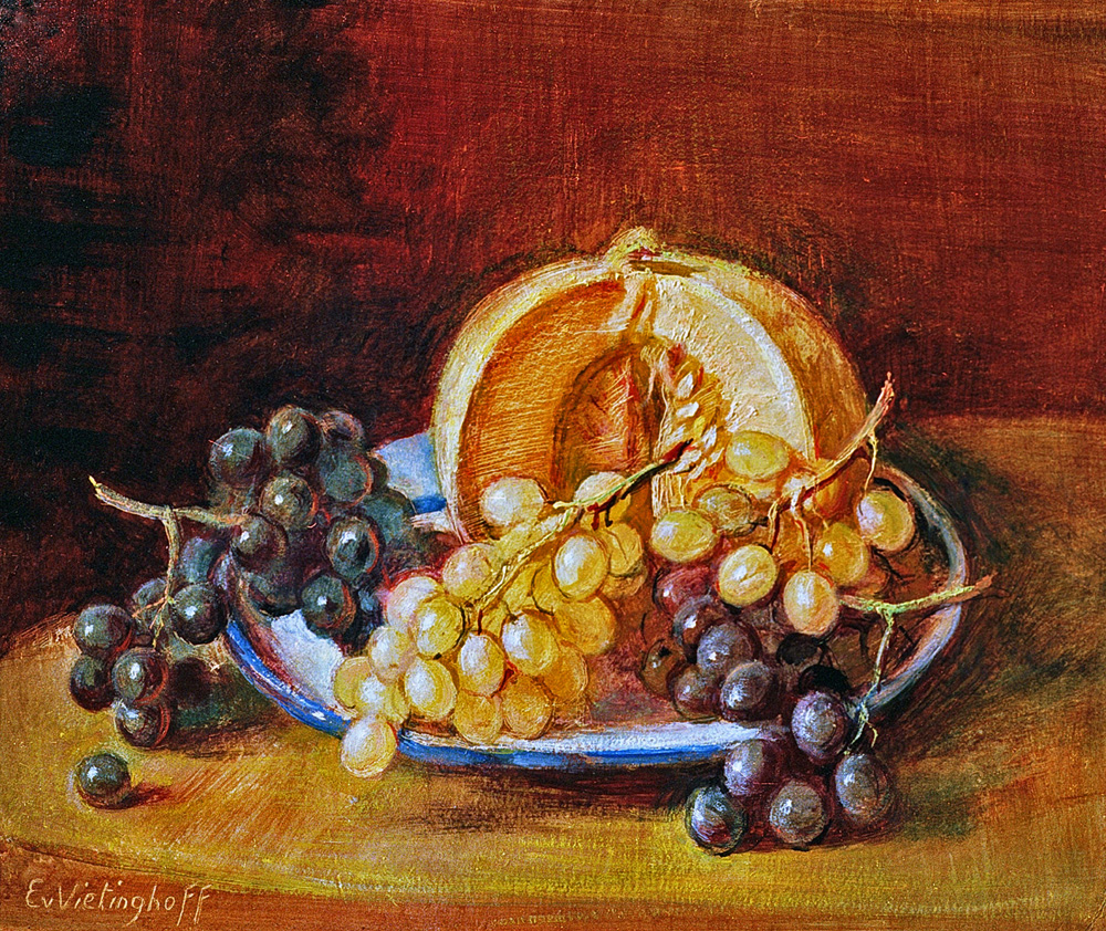 Melone und Trauben auf Teller Melone und Trauben auf Teller