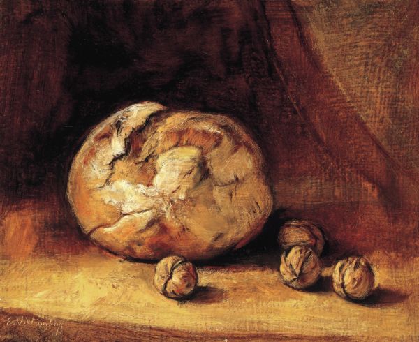 Rundes Brot und Walnüsse