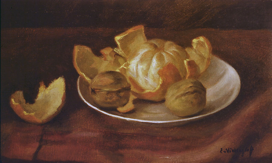 Mandarine und Walnüsse auf Tellerchen